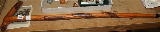 Carved walking stick with dogs head by Larry Laird